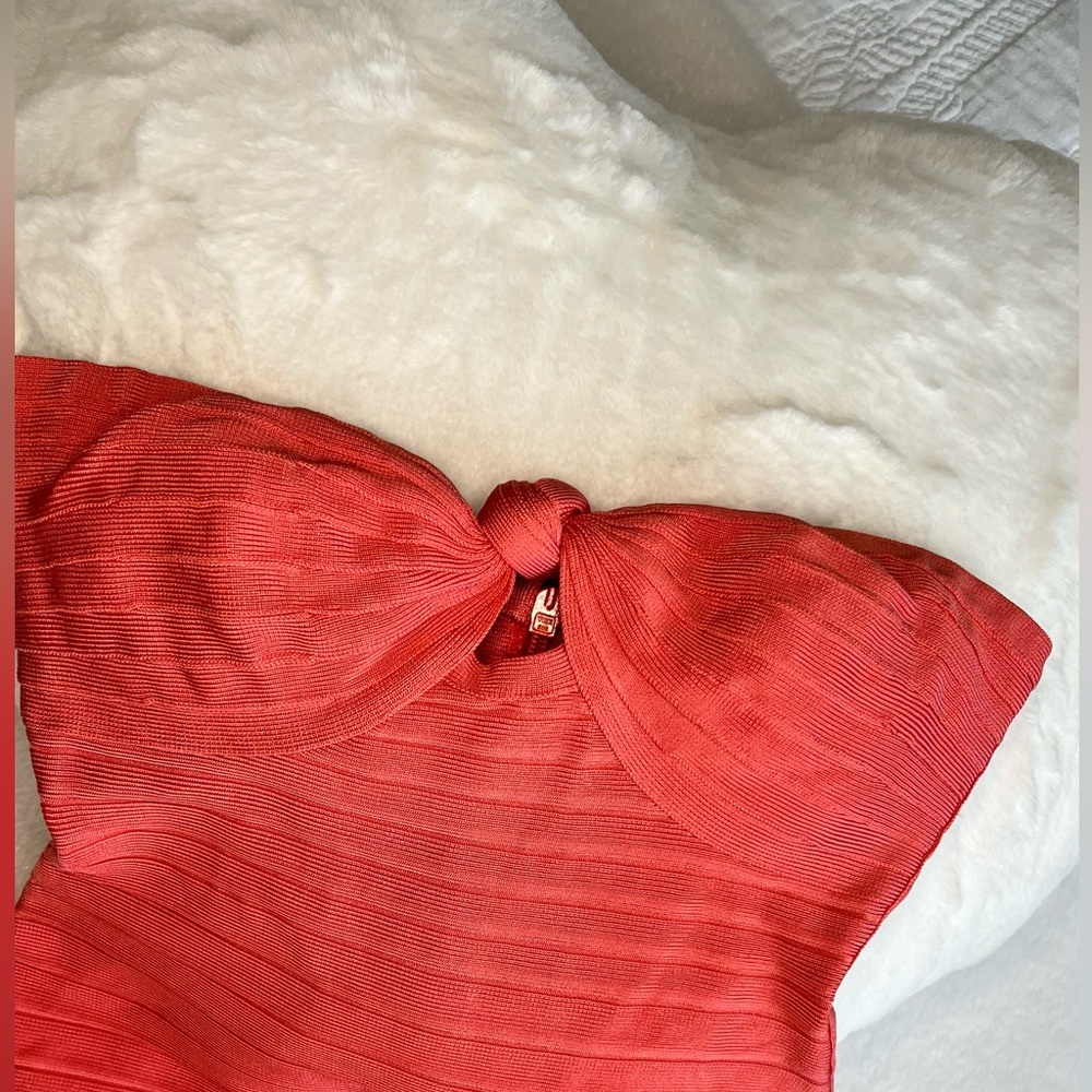 Get ready to turn heads in this stunning Herve Leger Dress.